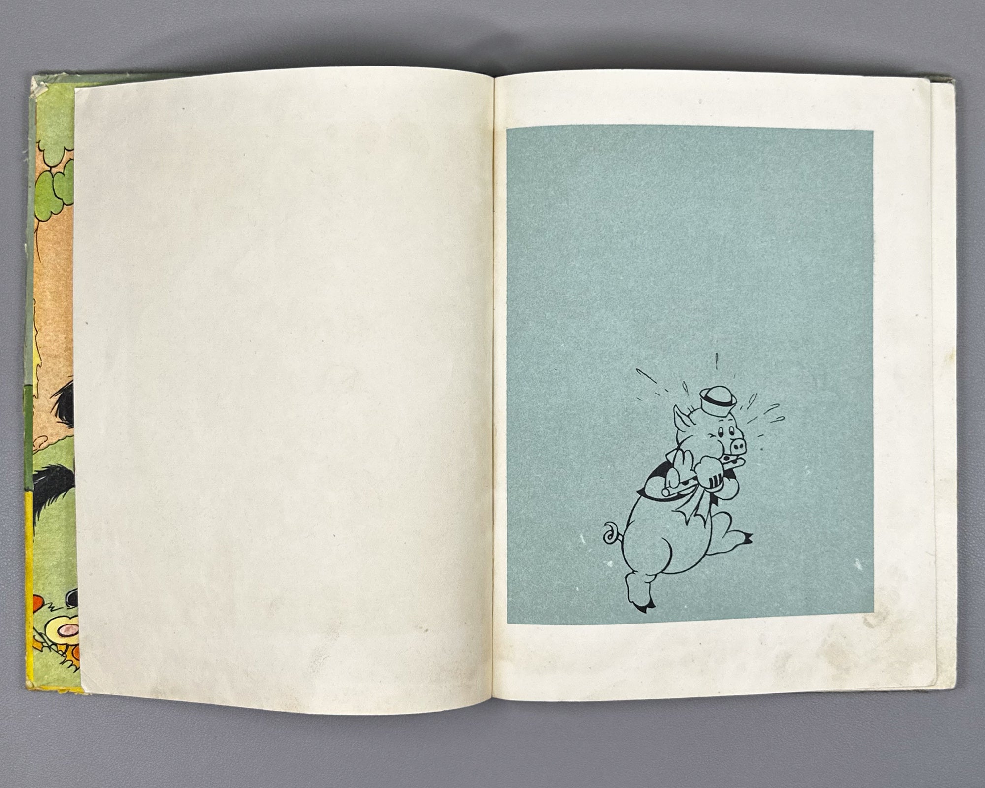 Mikhalkov, Sergey (trans.). Three Little Pigs (Tri porosenka). Text and illustrations by Walt Disney Studio, 1937. In Russian.