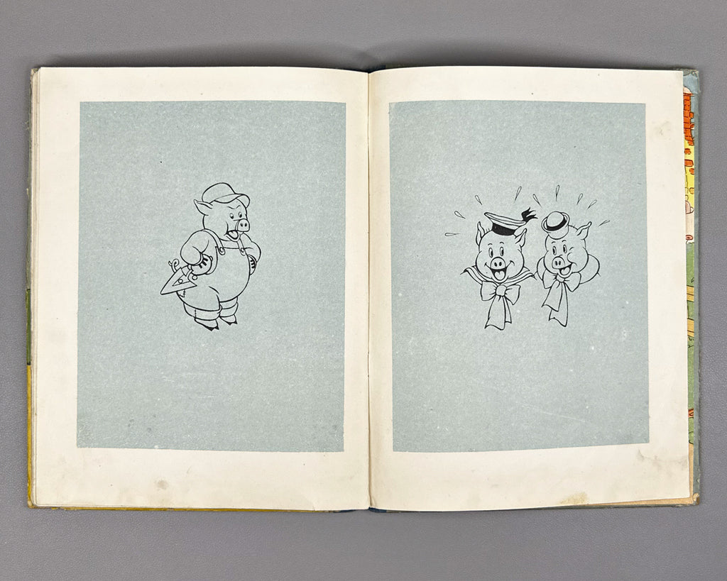 Mikhalkov, Sergey (trans.). Three Little Pigs (Tri porosenka). Text and illustrations by Walt Disney Studio, 1937. In Russian.