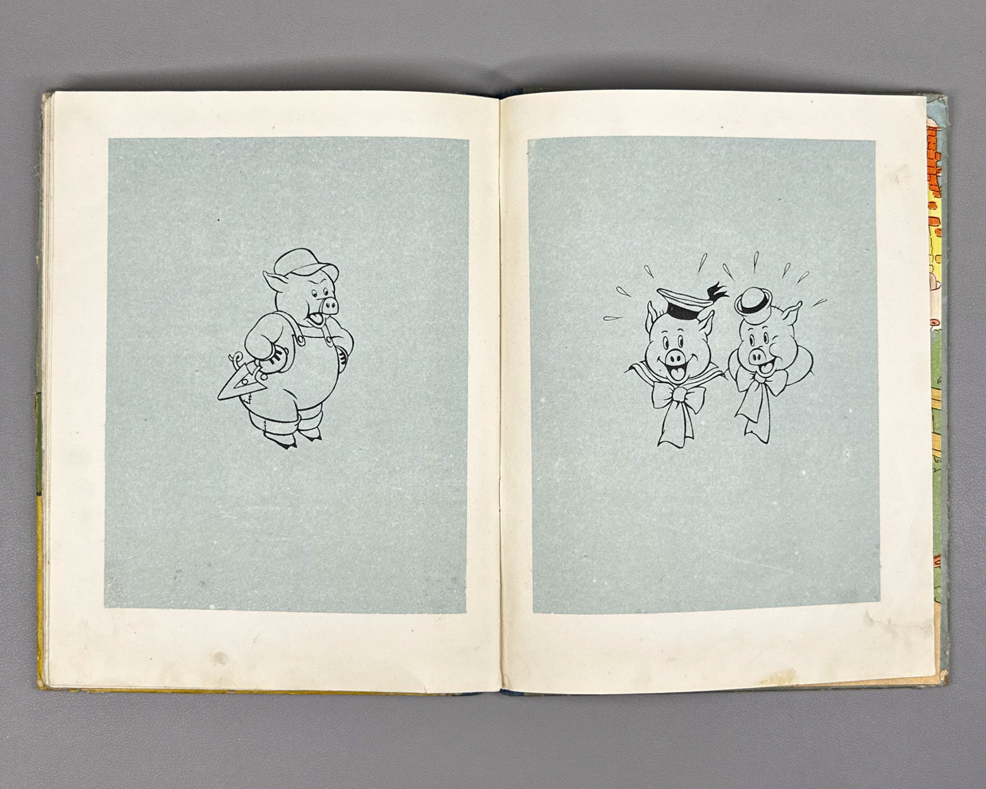 Mikhalkov, Sergey (trans.). Three Little Pigs (Tri porosenka). Text and illustrations by Walt Disney Studio, 1937. In Russian.